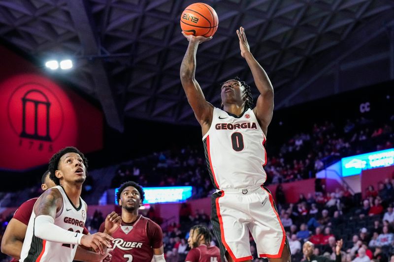 Dec 28, 2022; Athens, Georgia, USA; Georgia Bulldogs guard Terry Roberts (0) scores a basket against the Rider Broncs during the first half at Stegeman Coliseum. Mandatory Credit: Dale Zanine-USA TODAY Sports