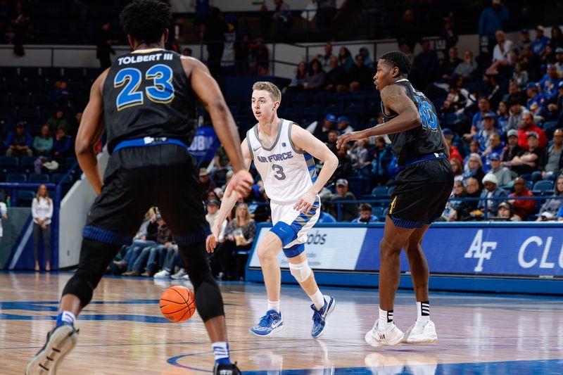 Mar 4, 2023; Colorado Springs, Colorado, USA; Air Force Falcons guard Jake Heidbreder (3) controls the ball as San Jose State Spartans guard Omari Moore (10) and forward Sage Tolbert III (23) guards in the second half at Clune Arena. Mandatory Credit: Isaiah J. Downing-USA TODAY Sports