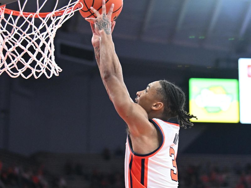 Feb 27, 2024; Syracuse, New York, USA; Syracuse Orange guard Judah Mintz (3) goes for a dunk against the Virginia Tech Hokies in the second half at the JMA Wireless Dome. Mandatory Credit: Mark Konezny-USA TODAY Sports