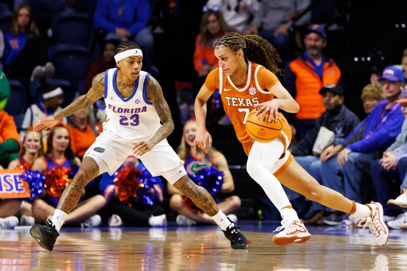Jan 29, 2026; Gainesville, Florida, USA; Texas Longhorns guard Jordan Lee (7) dribbles the ball against Florida Gators guard Liv McGill (23) during the first half at Exactech Arena at the Stephen C. O'Connell Center. Mandatory Credit: Matt Pendleton-Imagn Images