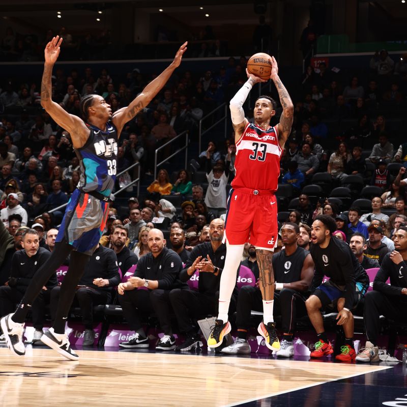 WASHINGTON, DC -? MARCH 27: Kyle Kuzma #33 of the Washington Wizards shoots a three point basket against the Brooklyn Nets on March 27, 2024 NBAE at Capital One Arena in Washington, DC. NOTE TO USER: User expressly acknowledges and agrees that, by downloading and or using this Photograph, user is consenting to the terms and conditions of the Getty Images License Agreement. Mandatory Copyright Notice: Copyright 2024 NBAE (Photo by Kenny Giarla/NBAE via Getty Images)