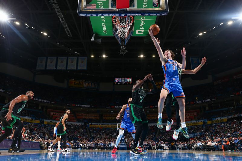 OKLAHOMA CITY, OK - JANUARY 3:  Josh Giddey #3 of the Oklahoma City Thunder drives to the basket during the game against the Boston Celtics on January 3, 2023 at Paycom Arena in Oklahoma City, Oklahoma. NOTE TO USER: User expressly acknowledges and agrees that, by downloading and or using this photograph, User is consenting to the terms and conditions of the Getty Images License Agreement. Mandatory Copyright Notice: Copyright 2023 NBAE (Photo by Zach Beeker/NBAE via Getty Images)