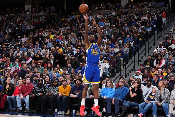 DENVER, CO - DECEMBER 25: Andrew Wiggins #22 of the Golden State Warriors shoots the ball during the game against the Denver Nuggets on December 25, 2023 at the Ball Arena in Denver, Colorado. NOTE TO USER: User expressly acknowledges and agrees that, by downloading and/or using this Photograph, user is consenting to the terms and conditions of the Getty Images License Agreement. Mandatory Copyright Notice: Copyright 2023 NBAE (Photo by Garrett Ellwood/NBAE via Getty Images)