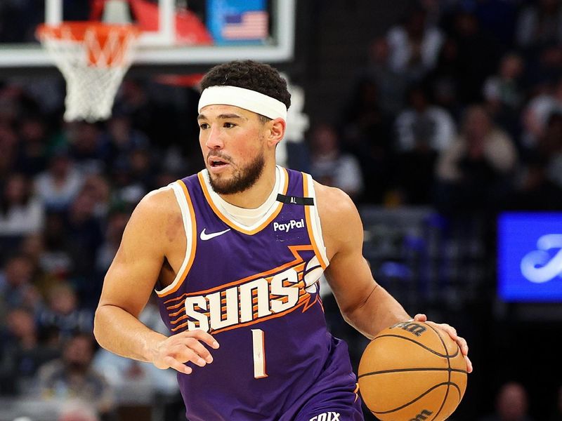 MINNEAPOLIS, MINNESOTA - NOVEMBER 17: Devin Booker #1 of the Phoenix Suns goes to the basket against the Minnesota Timberwolves in the third quarter at Target Center on November 17, 2024 in Minneapolis, Minnesota. The Timberwolves defeated the Suns 120-117. NOTE TO USER: User expressly acknowledges and agrees that, by downloading and or using this photograph, User is consenting to the terms and conditions of the Getty Images License Agreement. (Photo by David Berding/Getty Images)