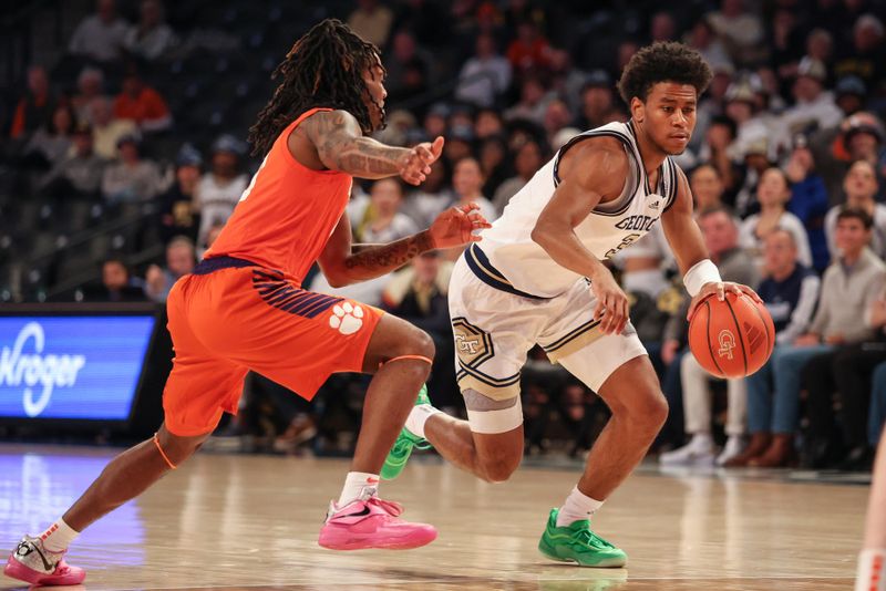 Jan 14, 2025; Atlanta, Georgia, USA; Georgia Tech guard Jaeden Mustaf (3) drives the ball to the basket against Clemson Tigers guard Del Jones (10) during the first half at McCamish Pavilion. Mandatory Credit: Jordan Godfree-Imagn Images