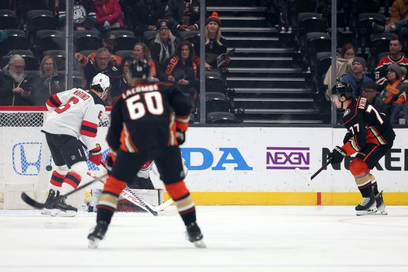 Mar 1, 2024; Anaheim, California, USA; Anaheim Ducks right wing Frank Vatrano (77) scores a goal against New Jersey Devils goaltender Nico Daws (50) during the first period at Honda Center. Mandatory Credit: Kiyoshi Mio-USA TODAY Sports