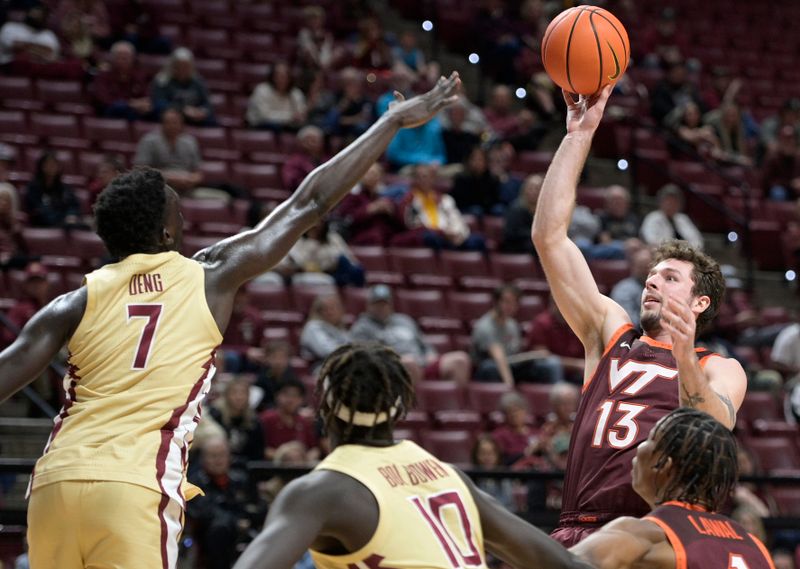 Jan 29, 2025; Tallahassee, Florida, USA; Virginia Tech Hokies forward Ben Burnham (13) shoots the ball during the second half of the game against the Florida State Seminoles at Donald L. Tucker Center. Mandatory Credit: Melina Myers-Imagn Images