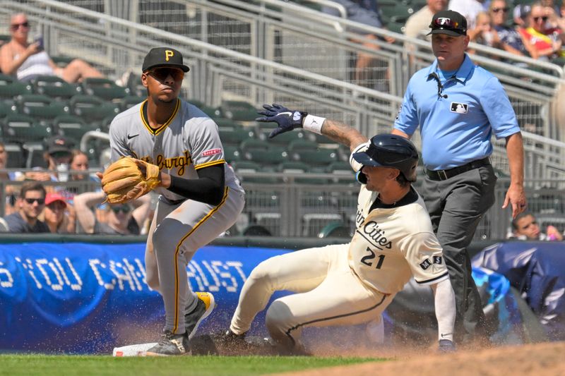 Jul 13, 2025; Minneapolis, Minnesota, USA; Minnesota Twins pinch-runner DaShawn Keirsey (21) is forced out at third base by Pittsburgh Pirates infielder Ke'Bryan Hayes (13) during the eighth inning at Target Field. Mandatory Credit: Nick Wosika-Imagn Images
