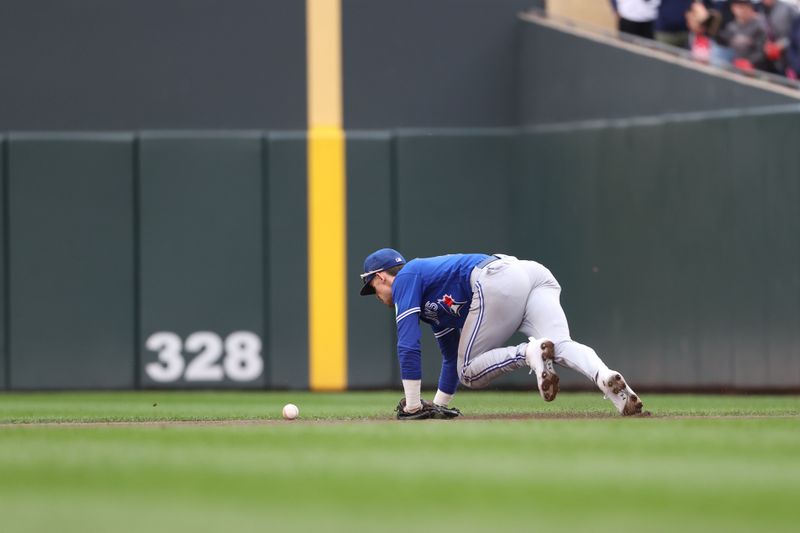 Oct 4, 2023; Minneapolis, Minnesota, USA; Toronto Blue Jays second baseman Cavan Biggio (8) is unable to field the ball in the fourth inning against the Minnesota Twins during game two of the Wildcard series for the 2023 MLB playoffs at Target Field. Mandatory Credit: Jesse Johnson-USA TODAY Sports