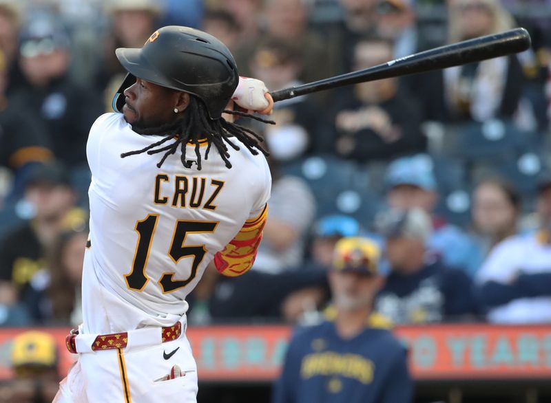 May 24, 2025; Pittsburgh, Pennsylvania, USA;  Pittsburgh Pirates center fielder Oneil Cruz (15) hits an RBI triple against the Milwaukee Brewers during the seventh inning at PNC Park. Mandatory Credit: Charles LeClaire-Imagn Images