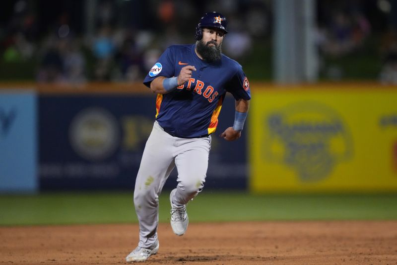 Mar 6, 2025; Port St. Lucie, Florida, USA;  Houston Astros infielder Luis Guillorme (0) goes from first to third base on a base hit in the third inning against the New York Mets at Clover Park. Mandatory Credit: Jim Rassol-Imagn Images