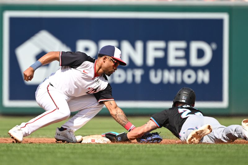 Sep 15, 2024; Washington, District of Columbia, USA; Washington Nationals shortstop Nasim Nunez (26) tags Miami Marlins second baseman Connor Norby (24) at second base during a stolen base attempt against the Miami Marlins during the third inning at Nationals Park. Mandatory Credit: Rafael Suanes-Imagn Images