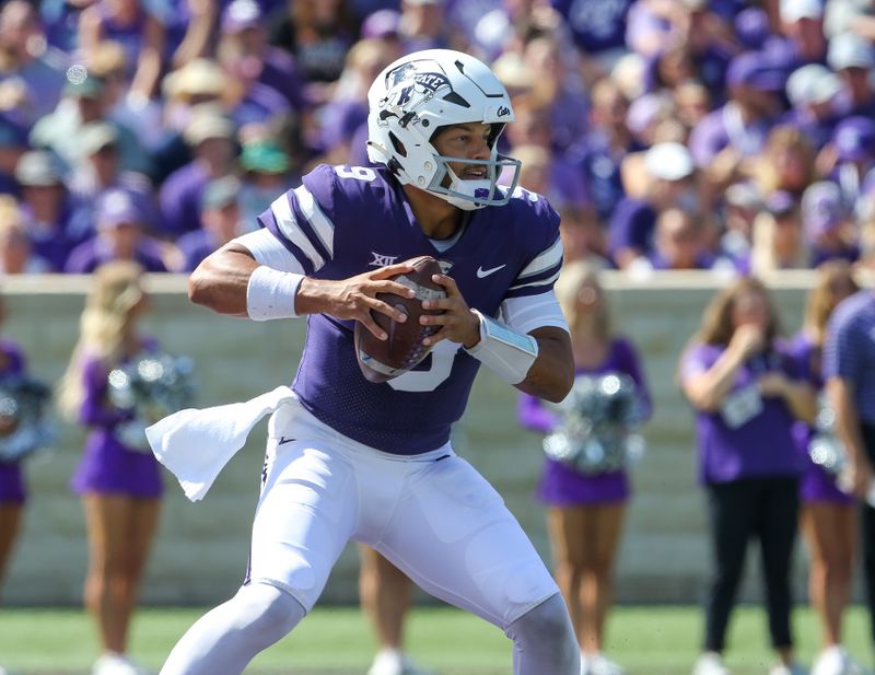 Sep 17, 2022; Manhattan, Kansas, USA; Kansas State Wildcats quarterback Adrian Martinez (9) looks for room to run during the first quarter against the Tulane Green Wave at Bill Snyder Family Football Stadium. Mandatory Credit: Scott Sewell-USA TODAY Sports