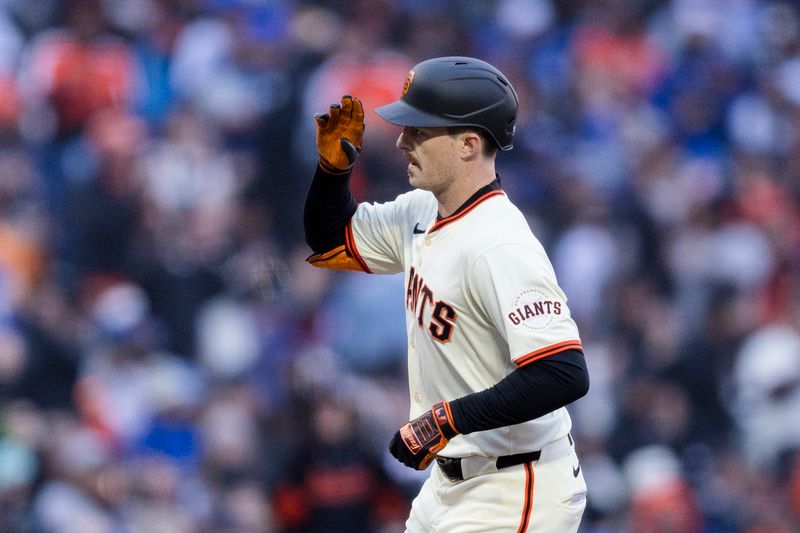 May 15, 2024; San Francisco, California, USA; San Francisco Giants right fielder Mike Yastrzemski (5) runs the bases after hitting a two-run home run against the Los Angeles Dodgers during the third inning at Oracle Park. Mandatory Credit: John Hefti-USA TODAY Sports