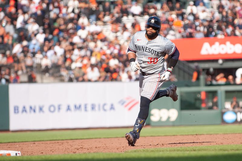 Jul 13, 2024; San Francisco, California, USA; Minnesota Twins first base Carlos Santana (30) rounds the bases after hitting a home run during the sixth inning of the game against the San Francisco Giants at Oracle Park. Mandatory Credit: Ed Szczepanski-USA TODAY Sports