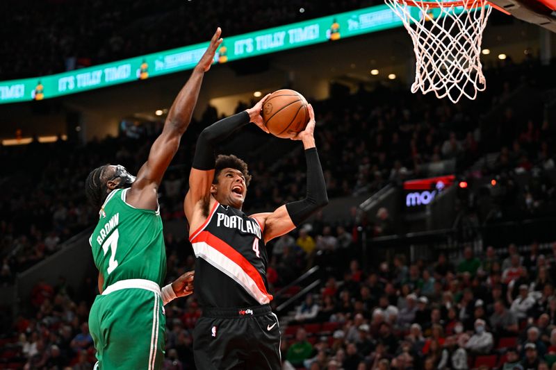 PORTLAND, OREGON - MARCH 17: Matisse Thybulle #4 of the Portland Trail Blazers drives to the basket against Jaylen Brown #7 of the Boston Celtics during the second quarter at the Moda Center on March 17, 2023 in Portland, Oregon. The Boston Celtics won 126-112. NOTE TO USER: User expressly acknowledges and agrees that, by downloading and or using this photograph, User is consenting to the terms and conditions of the Getty Images License Agreement. (Photo by Alika Jenner/Getty Images)