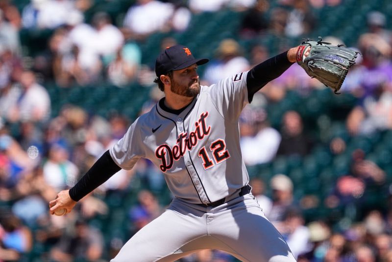 May 8, 2025; Denver, Colorado, USA; Detroit Tigers starting pitcher Casey Mize (12) delivers a pitch in the sixth inning against the Colorado Rockies at Coors Field. Mandatory Credit: Ron Chenoy-Imagn Images
