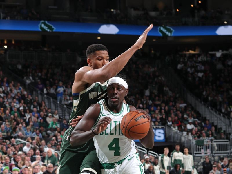 MILWAUKEE, WI - NOVEMBER 10: Jrue Holiday #4 of the Boston Celtics drives to the basket during the game against the Milwaukee Bucks on November 10, 2024 at the Fiserv Forum Center in Milwaukee, Wisconsin. NOTE TO USER: User expressly acknowledges and agrees that, by downloading and or using this Photograph, user is consenting to the terms and conditions of the Getty Images License Agreement. Mandatory Copyright Notice: Copyright 2024 NBAE (Photo by Gary Dineen/NBAE via Getty Images).