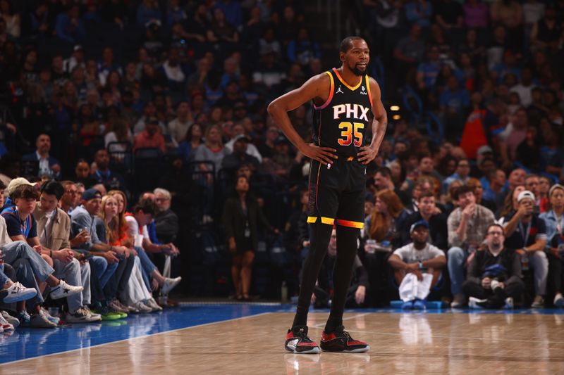 OKLAHOMA CITY, OK - MARCH 29:  Kevin Durant #35 of the Phoenix Suns looks on during the game against the Oklahoma City Thunder on March 29, 2024 at Paycom Arena in Oklahoma City, Oklahoma. NOTE TO USER: User expressly acknowledges and agrees that, by downloading and or using this photograph, User is consenting to the terms and conditions of the Getty Images License Agreement. Mandatory Copyright Notice: Copyright 2024 NBAE (Photo by Zach Beeker/NBAE via Getty Images)