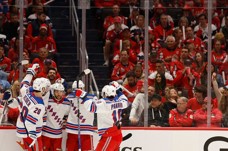 Apr 26, 2024; Washington, District of Columbia, USA; New York Rangers center Vincent Trocheck (16) celebrates with teammates after scoring a goal against the Washington Capitals in the second period in game three of the first round of the 2024 Stanley Cup Playoffs at Capital One Arena. Mandatory Credit: Geoff Burke-USA TODAY Sports