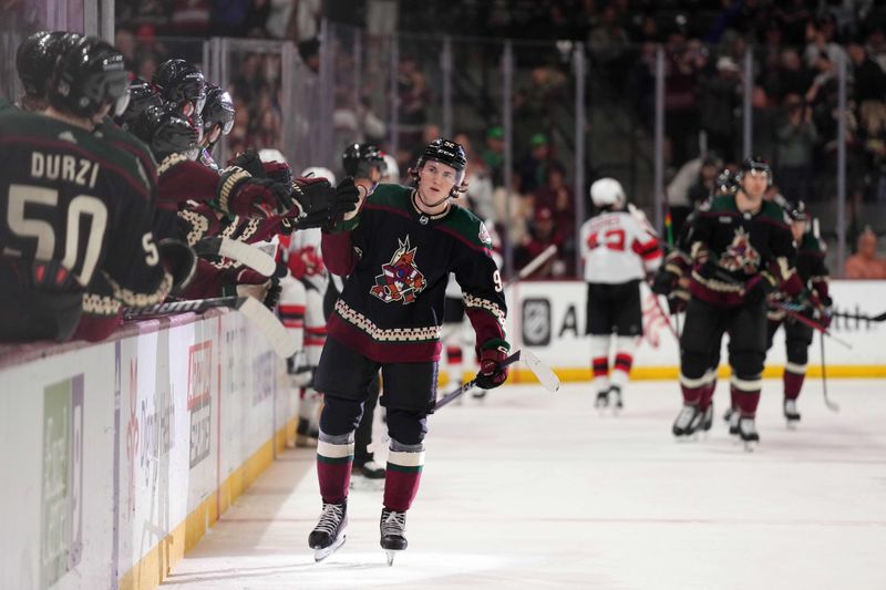 Mar 16, 2024; Tempe, Arizona, USA; Arizona Coyotes center Logan Cooley (92) celebrates his goal against the New Jersey Devils during the first period at Mullett Arena. Mandatory Credit: Joe Camporeale-USA TODAY Sports