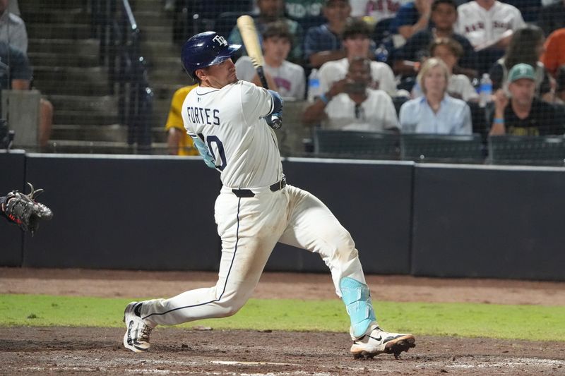 Sep 21, 2025; Tampa, Florida, USA; Tampa Bay Rays catcher Nick Fortes (40) hits a single against the Boston Red Sox during the eighth inning at George M. Steinbrenner Field. Mandatory Credit: Dave Nelson-Imagn Images