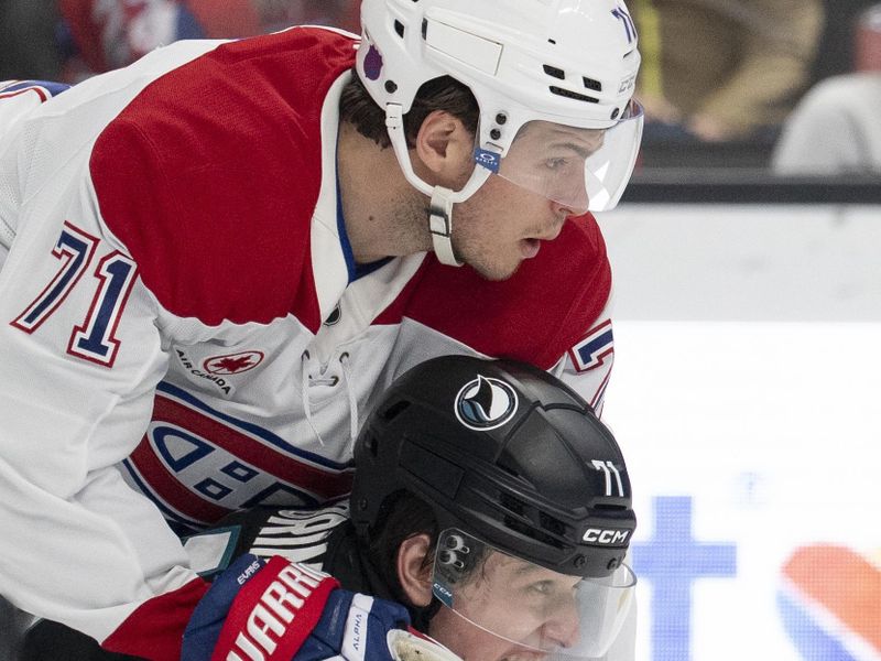 Mar 3, 2026; San Jose, California, USA;  Montreal Canadiens center Jake Evans (71) holds onto San Jose Sharks center Macklin Celebrini (71) during the second period at SAP Center at San Jose. Mandatory Credit: Stan Szeto-Imagn Images