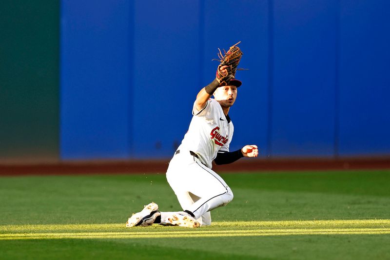 Oct 7, 2024; Cleveland, Ohio, USA; Cleveland Guardians outfielder Steven Kwan (38) dives to make a catch during the eighth inning against the Detroit Tigers during game two of the ALDS for the 2024 MLB Playoffs at Progressive Field. Mandatory Credit: Scott Galvin-Imagn Images