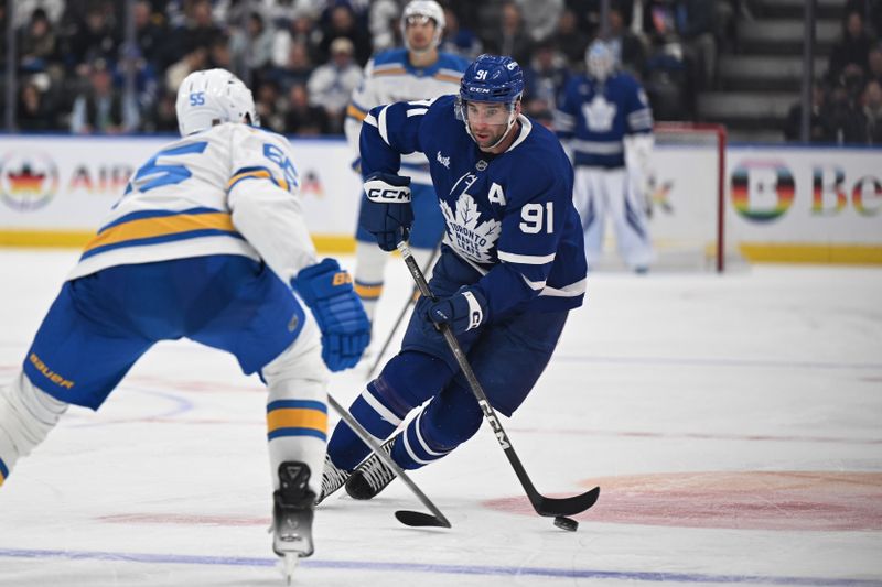 Nov 18, 2025; Toronto, Ontario, CAN;  Toronto Maple Leafs forward John Tavares (91) skates with the puck against St. Louis Blues defenseman Colton Parayko (55) in the third period at Scotiabank Arena. Mandatory Credit: Dan Hamilton-Imagn Images