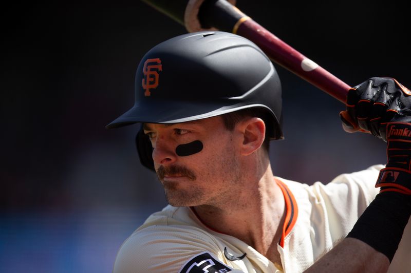 May 18, 2024; San Francisco, California, USA; San Francisco Giants right fielder Mike Yastrzemski (5) awaits his turn at bat against the Colorado Rockies during the sixth inning at Oracle Park. Mandatory Credit: D. Ross Cameron-USA TODAY Sports