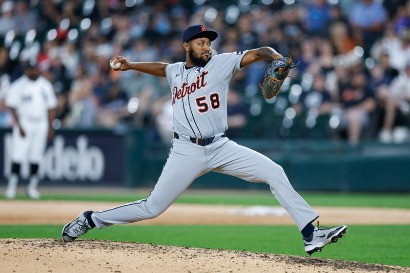 Jun 2, 2025; Chicago, Illinois, USA; Detroit Tigers relief pitcher Dylan Smith (58) delivers a pitch against the Chicago White Sox during the seventh inning at Rate Field. Mandatory Credit: Kamil Krzaczynski-Imagn Images