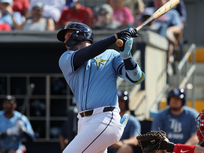 Feb 25, 2025; Port Charlotte, Florida, USA; Tampa Bay Rays second baseman Curtis Mead (25) doubles against the Philadelphia Phillies during the sixth inning at Charlotte Sports Park. Mandatory Credit: Kim Klement Neitzel-Imagn Images