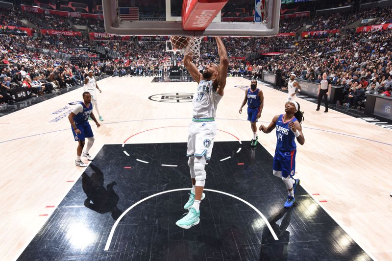 LOS ANGELES, CA - MARCH 12: Rudy Gobert #27 of the Minnesota Timberwolves dunks the ball during the game against the LA Clippers on March 12, 2024 at Crypto.Com Arena in Los Angeles, California. NOTE TO USER: User expressly acknowledges and agrees that, by downloading and/or using this Photograph, user is consenting to the terms and conditions of the Getty Images License Agreement. Mandatory Copyright Notice: Copyright 2024 NBAE (Photo by Tyler Ross/NBAE via Getty Images)