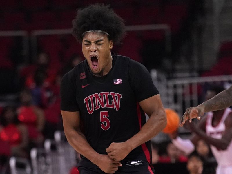 Feb 14, 2024; Fresno, California, USA; UNLV Rebels forward Rob Whaley Jr. (5) reacts after dunking the ball against the Fresno State Bulldogs in the second half at the Save Mart Center. Mandatory Credit: Cary Edmondson-USA TODAY Sports