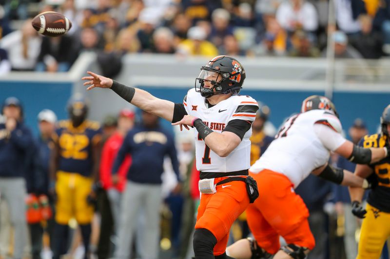 Oct 21, 2023; Morgantown, West Virginia, USA; Oklahoma State Cowboys quarterback Alan Bowman (7) passes the ball against the West Virginia Mountaineers during the second quarter at Mountaineer Field at Milan Puskar Stadium. Mandatory Credit: Ben Queen-USA TODAY Sports