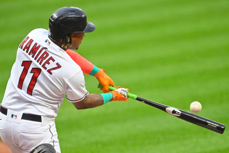 Jun 8, 2023; Cleveland, Ohio, USA; Cleveland Guardians third baseman Jose Ramirez (11) hits a solo home run in the first inning against the Boston Red Sox at Progressive Field. Mandatory Credit: David Richard-USA TODAY Sports