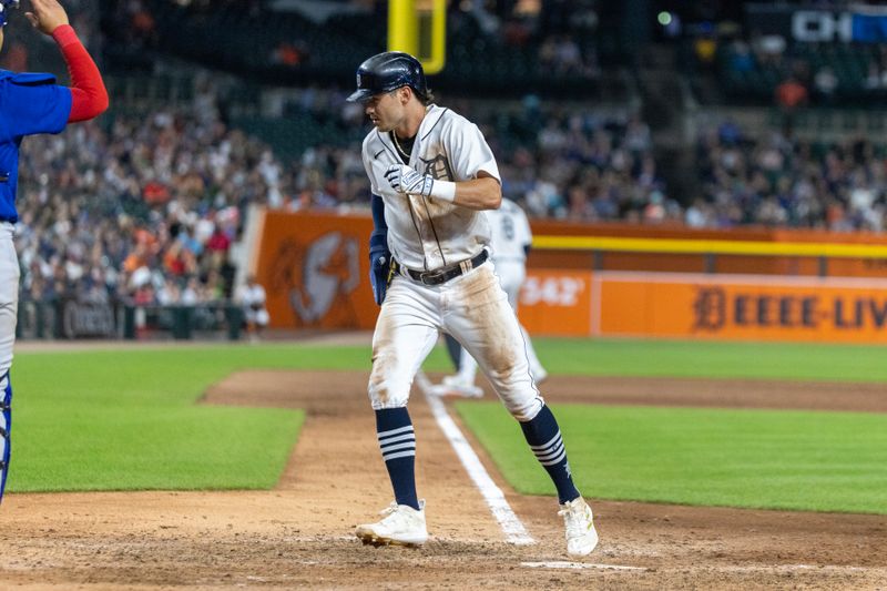 Aug 22, 2023; Detroit, Michigan, USA; Detroit Tigers right fielder Zach McKinstry (39) scores a run in the eighth inning against the Chicago Cubs at Comerica Park. Mandatory Credit: David Reginek-USA TODAY Sports