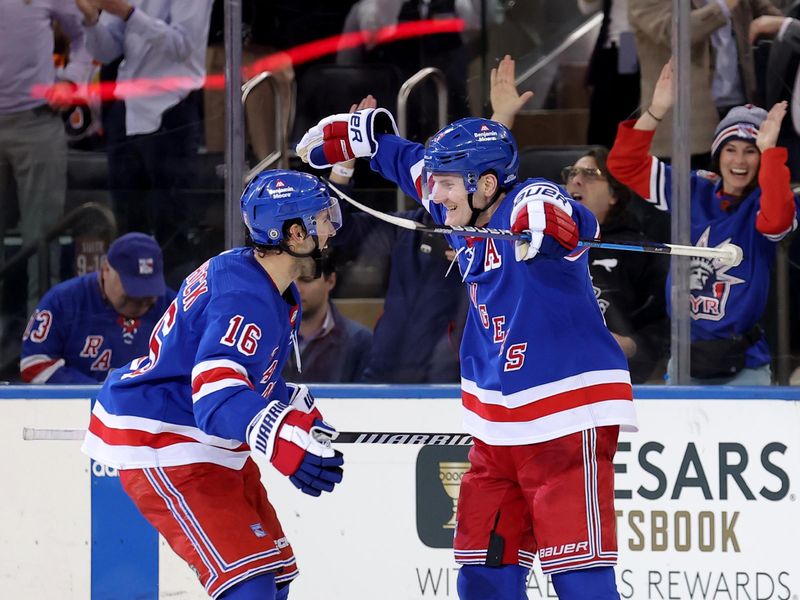 Mar 26, 2024; New York, New York, USA; New York Rangers defenseman Adam Fox (23) celebrates his game winning goal against the Philadelphia Flyers with center Vincent Trocheck (16) during overtime at Madison Square Garden. Mandatory Credit: Brad Penner-USA TODAY Sports