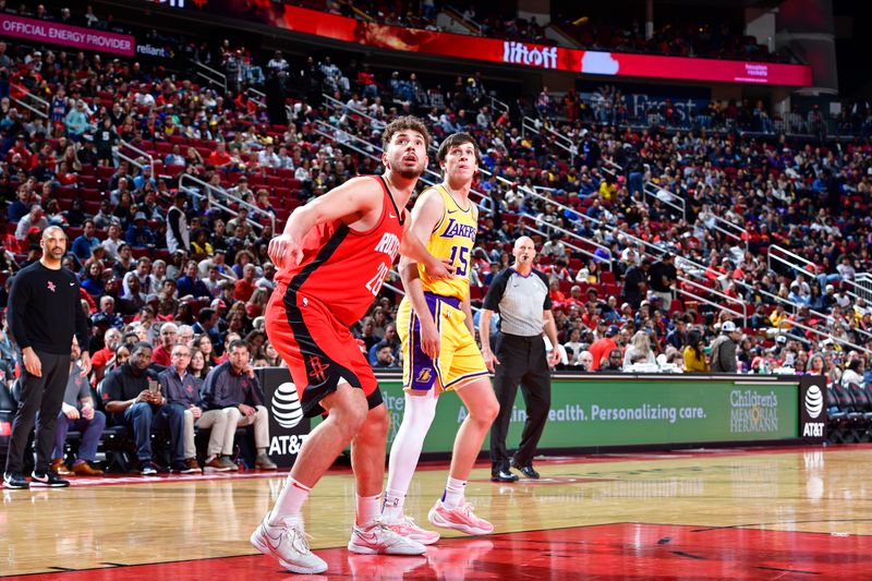 HOUSTON, TX - JANUARY 29:  Alperen Sengun #28 of the Houston Rockets and Austin Reaves #15 of the Los Angeles Lakers look on during the game on January 29, 2024 at the Toyota Center in Houston, Texas. NOTE TO USER: User expressly acknowledges and agrees that, by downloading and or using this photograph, User is consenting to the terms and conditions of the Getty Images License Agreement. Mandatory Copyright Notice: Copyright 2024 NBAE (Photo by Logan Riely/NBAE via Getty Images)