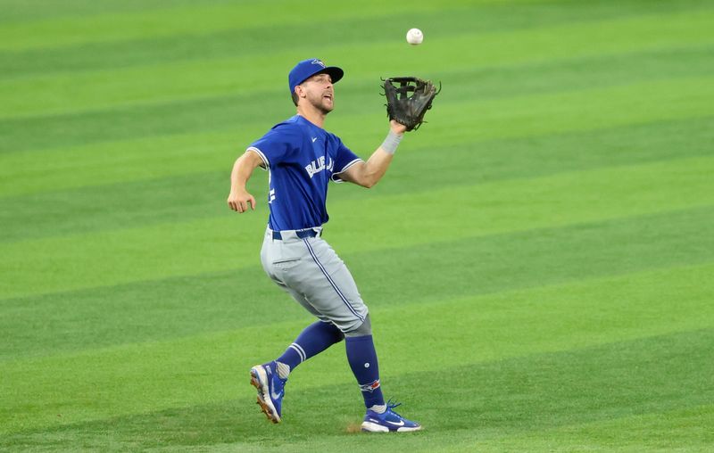 May 27, 2025; Arlington, Texas, USA; Toronto Blue Jays shortstop Ernie Clement (22) makes a catch during the sixth inning against the Texas Rangers at Globe Life Field. Mandatory Credit: Kevin Jairaj-Imagn Images