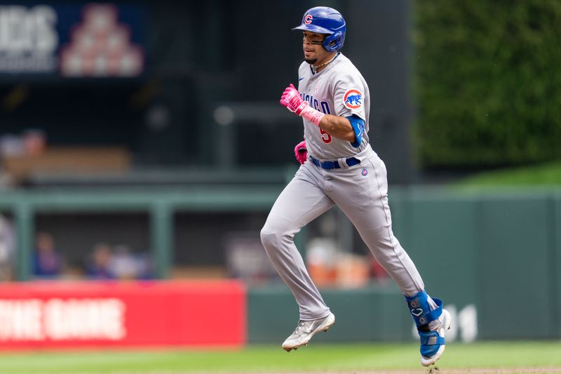 May 14, 2023; Minneapolis, Minnesota, USA; Chicago Cubs center fielder Christopher Morel (5) rounds second base after hitting a home run against Minnesota Twins starting pitcher Louie Varland (37) in the fourth inning at Target Field. Mandatory Credit: Matt Blewett-USA TODAY Sports