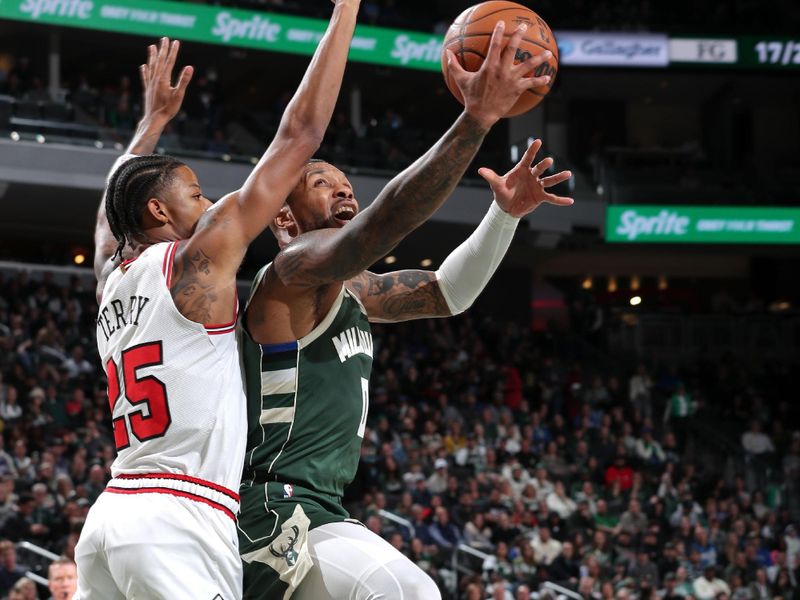 MILWAUKEE, WI - NOVEMBER 20: Damian Lillard #0 of the Milwaukee Bucks drives to the basket during the game against the Chicago Bulls on November 20, 2024 at the Fiserv Forum Center in Milwaukee, Wisconsin. NOTE TO USER: User expressly acknowledges and agrees that, by downloading and or using this Photograph, user is consenting to the terms and conditions of the Getty Images License Agreement. Mandatory Copyright Notice: Copyright 2024 NBAE (Photo by Gary Dineen/NBAE via Getty Images).