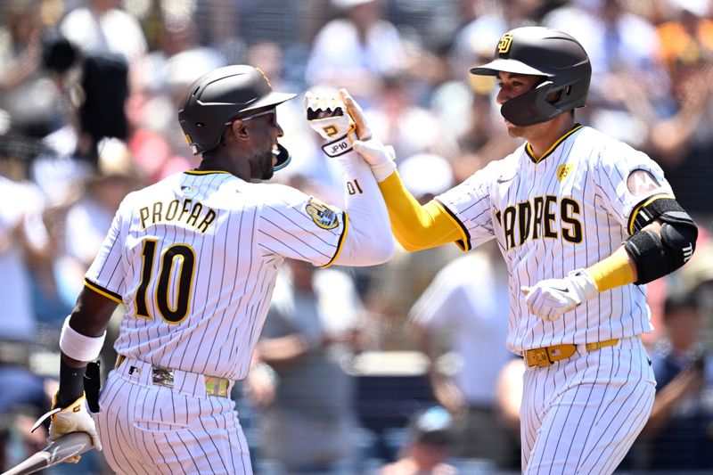 Jun 26, 2024; San Diego, California, USA; San Diego Padres catcher Kyle Higashioka (right) is congratulated by left fielder Jurickson Profar (10) after hitting a two-run home run against the Washington Nationals during the second inning at Petco Park. Mandatory Credit: Orlando Ramirez-USA TODAY Sports