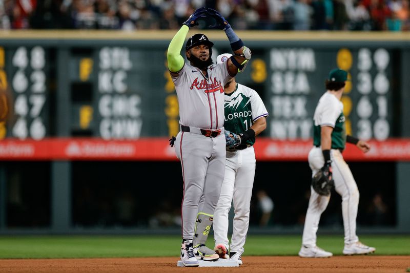 Aug 10, 2024; Denver, Colorado, USA; Atlanta Braves designated hitter Marcell Ozuna (20) reacts from second on a double in the seventh inning against the Colorado Rockies at Coors Field. Mandatory Credit: Isaiah J. Downing-USA TODAY Sports