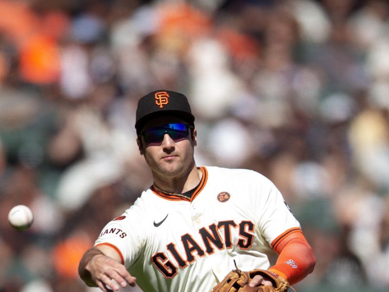 Sep 29, 2024; San Francisco, California, USA; San Francisco Giants third baseman Casey Schmitt (10) throws out St. Louis Cardinals pinch hitter Luken Baker during the seventh inning at Oracle Park. Mandatory Credit: D. Ross Cameron-Imagn Images