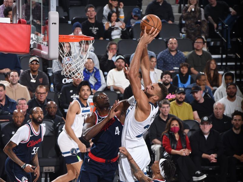INGLEWOOD, CA - DECEMBER 4:  Rudy Gobert #27 of the Minnesota Timberwolves drives to the basket during the game against the LA Clippers during a regular season game on December 4, 2024 at Intuit Dome in Los Angeles, California. NOTE TO USER: User expressly acknowledges and agrees that, by downloading and/or using this Photograph, user is consenting to the terms and conditions of the Getty Images License Agreement. Mandatory Copyright Notice: Copyright 2024 NBAE (Photo by Juan Ocampo/NBAE via Getty Images)