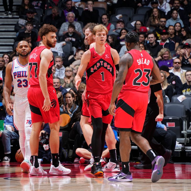 TORONTO, CANADA - OCTOBER 25: Gradey Dick #1 and Jamal Shead #23 of the Toronto Raptors high five during the game against the Philadelphia 76ers on October 25, 2024 at the Scotiabank Arena in Toronto, Ontario, Canada.  NOTE TO USER: User expressly acknowledges and agrees that, by downloading and or using this Photograph, user is consenting to the terms and conditions of the Getty Images License Agreement.  Mandatory Copyright Notice: Copyright 2024 NBAE (Photo by Mark Blinch/NBAE via Getty Images)