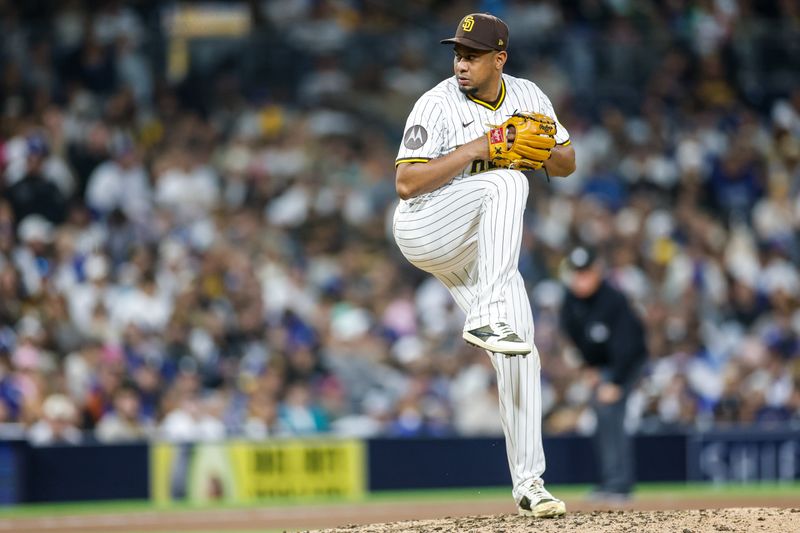 Jun 9, 2025; San Diego, California, USA; San Diego Padres relief pitcher Wandy Peralta (58) throws a pitch during the tenth inning against the Los Angeles Dodgers at Petco Park. Mandatory Credit: David Frerker-Imagn Images
