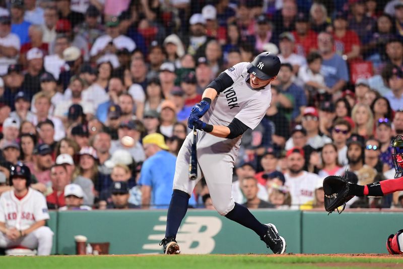 Jul 28, 2024; Boston, Massachusetts, USA; New York Yankees first baseman Ben Rice (93) hits an RBI single against the Boston Red Sox during the fourth inning at Fenway Park. Mandatory Credit: Eric Canha-USA TODAY Sports