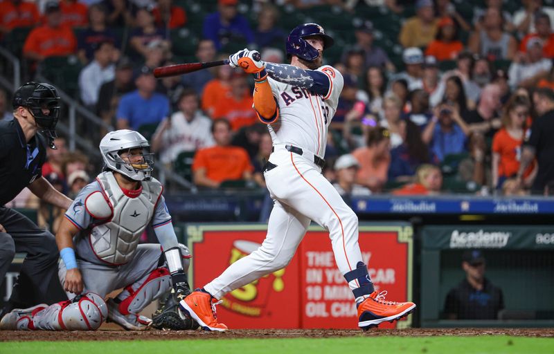 Jul 10, 2024; Houston, Texas, USA; Houston Astros right fielder Trey Cabbage (38) hits an RBI double during the sixth inning against the Miami Marlins at Minute Maid Park. Mandatory Credit: Troy Taormina-USA TODAY Sports